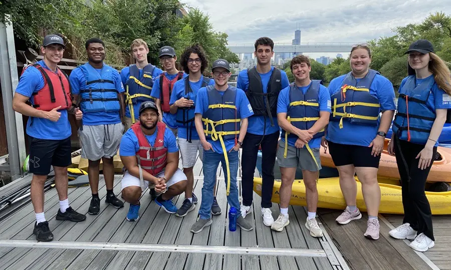 A group of TimberTech employees pose for a photo while participating in Chicago river clean up